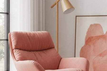 Fauteuil de relaxation bas en tissu rose avec une structure fine en métal noir